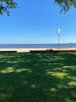 Image of Cute house on Saginaw Bay with hot tub on private beach.