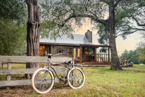 Image of Texas Cabin with cowboy pool and fire pit. Located in Bryan TX.