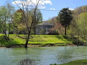 Image of Charming, remodeled farmhouse on the river to kayak with a hot tub & a firepit!!