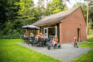 Image of When staying in this 12-person bungalow, you don't have a garden, but a whole forest! On the terrace, you can enjoy the outdoors.