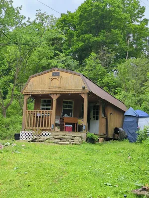 Image of Escape to Serenity: Off-Grid Cabin on Spring-Fed Pond, Your\nPrivate Sanctuary.