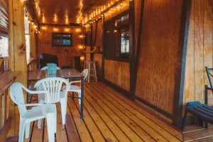 Image of Cozy cabin with a beautiful wrap-around porch