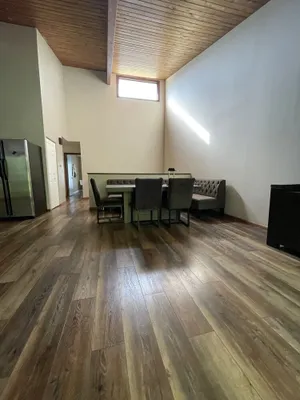 Image of large 3 beds 2 bath Townhome with 20' high ceiling and stone fire place.