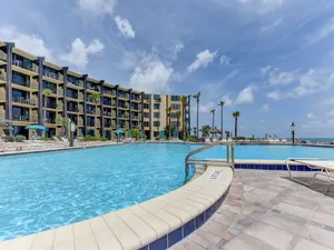 Image of Beach Condo Beach Front, Huge Outdoor Pool, Heated Indoor Pool, Kiddie Pool, Tiki Bar