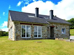 Image of Detached natural stone house with sunny garden and terrace, modern interior