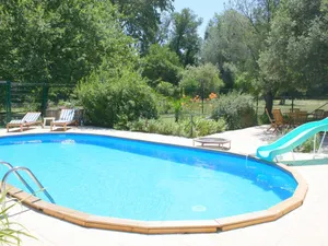 Image of Large House With Pool in a Lush Green Environment