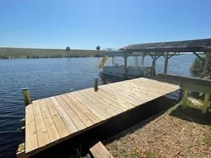 Image of Rim Canal Cottage 'Yellow House' with Canal Views & Boat Dock by RedAwning
