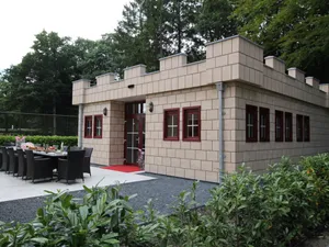 Image of Designed home with bedstead, surrounded by forest