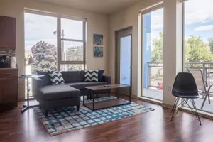Image of Modern East Side 1BR Apt with Balcony, Pool, and Gym