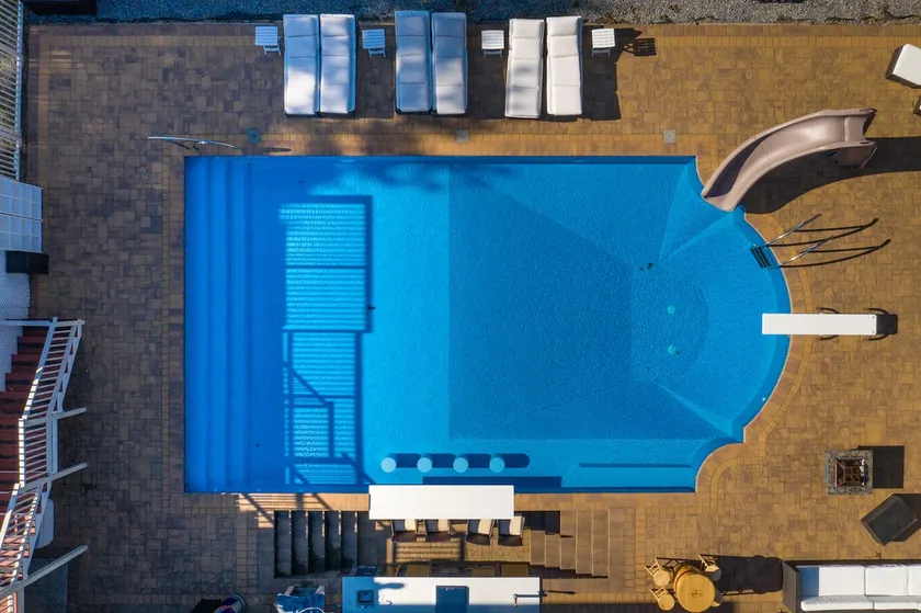 Resort style living in the Hamptons! Unbelievable pool with swim up bar & slide - Image 1