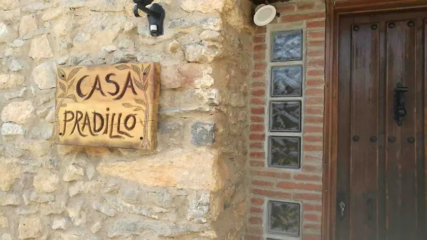 Rustic house with patio and indoor fireplace - Image 1