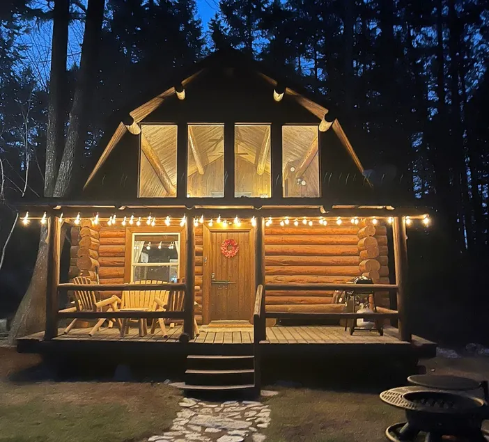 Rustic log cabin nestled in the woods - Image 1