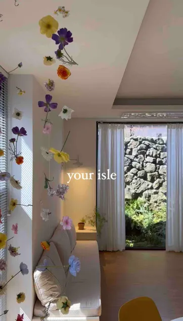 Your Isle / A private multi-story house with stone walls and plants - Image 1