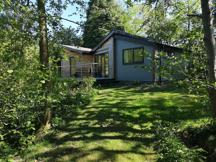 Mouse House set on the edge of a lake in Mid Wales - Image 1