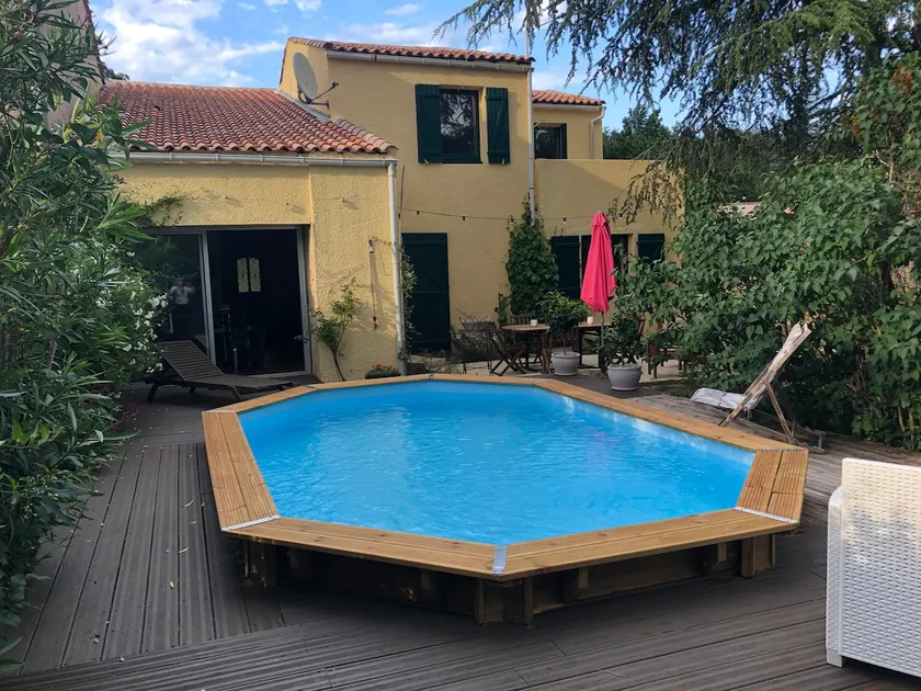 Pavilion in a green setting with pool - Image 1