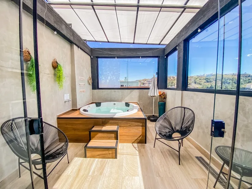 Uai House Mg features a Jacuzzi with a retractable roof top - Image 1