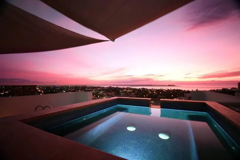View of the bay, swimming pool, and whirlpool. - Image 1