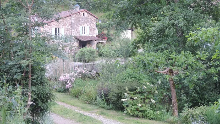 In the shade of a Rouergue mill by the water - Image 1