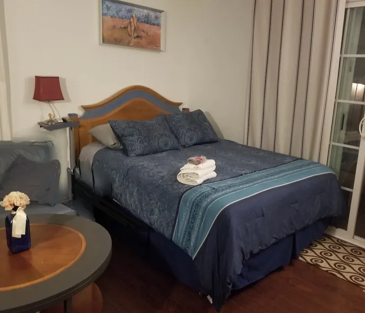 A cozy studio with private patio. - Image 1