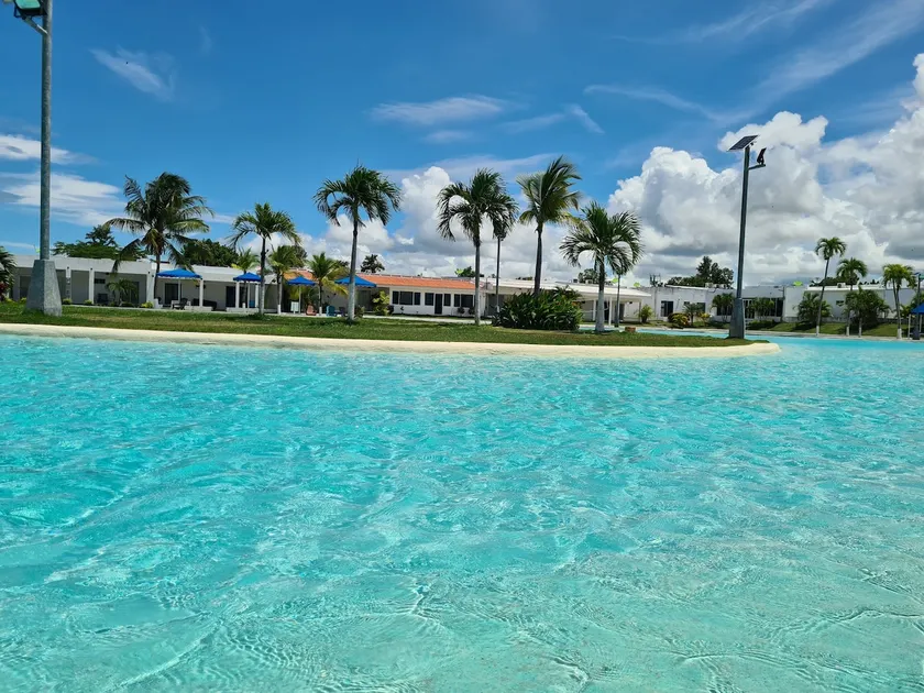 A relaxing retreat with a pool view and amenities - Image 1