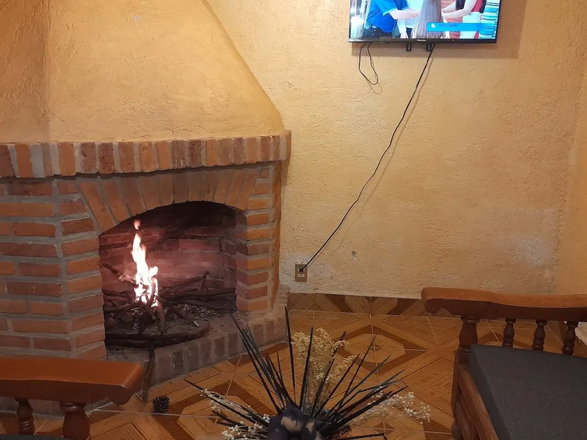 A relaxing place with an indoor fireplace - Image 1