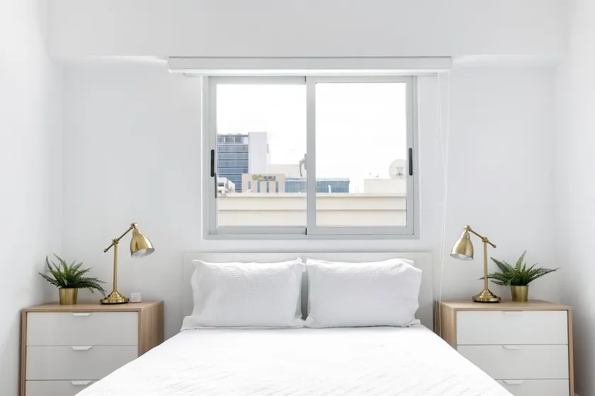 Take in City Views from a Wicker Armchair on the Balcony - Image 1