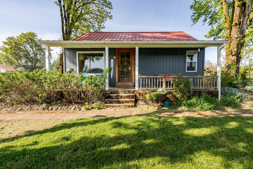 Cozy cottage surrounded by farmland - Image 1