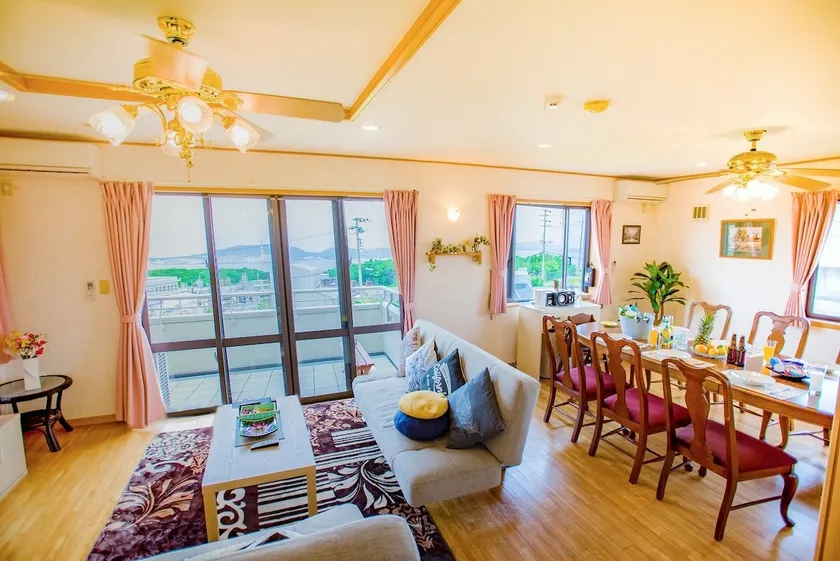 Spend a wonderful time on the balcony while looking out at the sea. URUMA STAY Country - Image 1