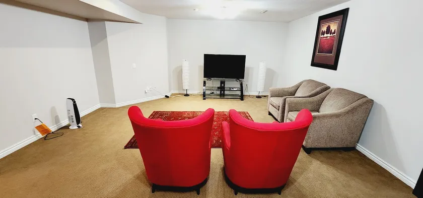 Unique full basement suite with spacious living room. - Image 1