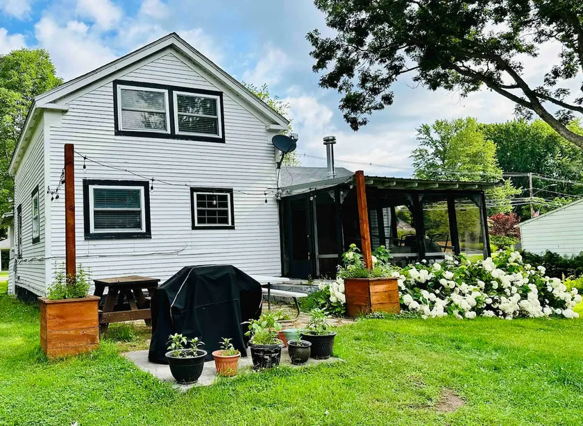 Experience the charm of a rustic lakefront cottage, perfect for year-round fun! - Image 1