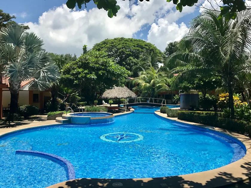 Apartment surrounded by beautiful gardens and a pool - Image 1