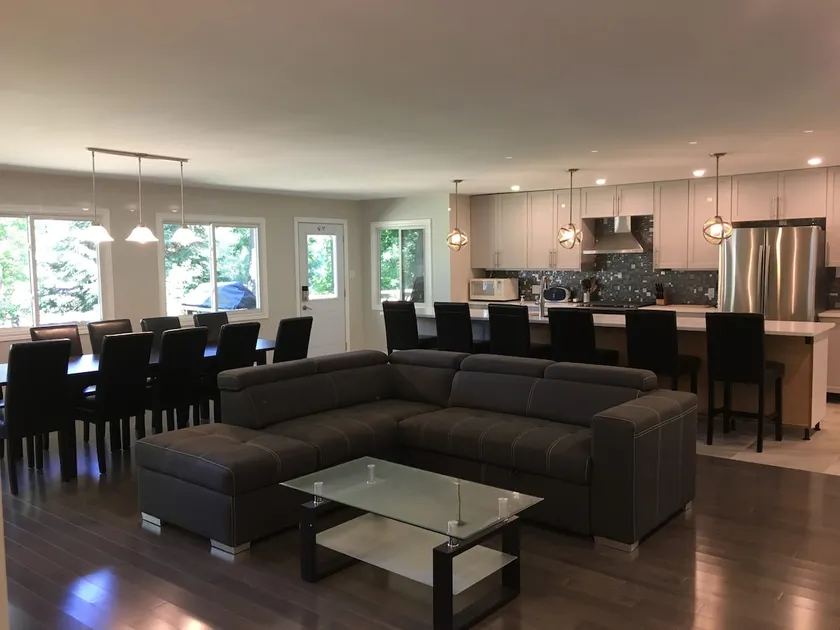 Spacious open concept kitchen and living room. - Image 1