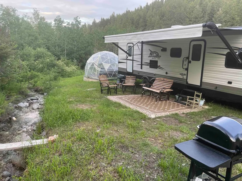 Into the Woods 32’ Camper with Slide-Out, Hot Tub - Image 1