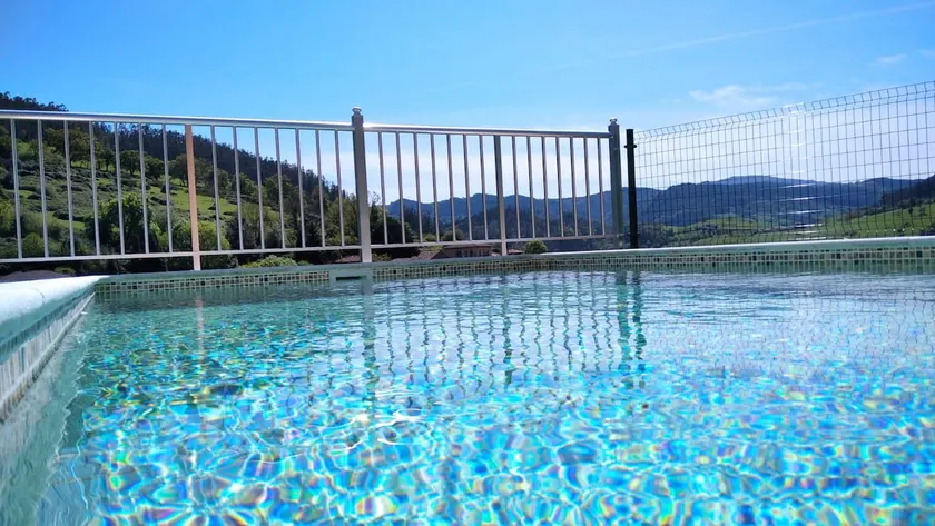 house with a pool and a hot tub - Image 1