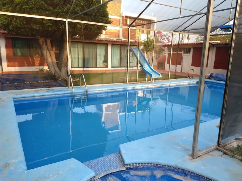 A vacation home with a pool and a hot tub - Image 1