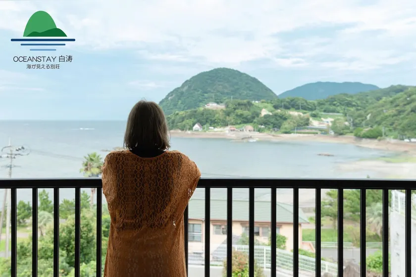 OCEAN STAY HAKUTO: A building with a tiled roof and a vibrant orange color against the backdrop of the ocean and sky will welcome you - Image 1