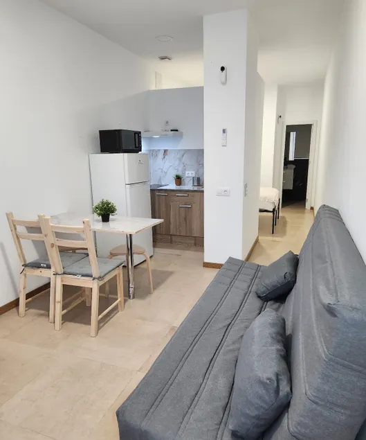 Apartamentos de Juan Manuel, Apartment with bed. - Image 1
