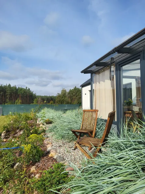 House on a hill with a tub near the forest - Image 1
