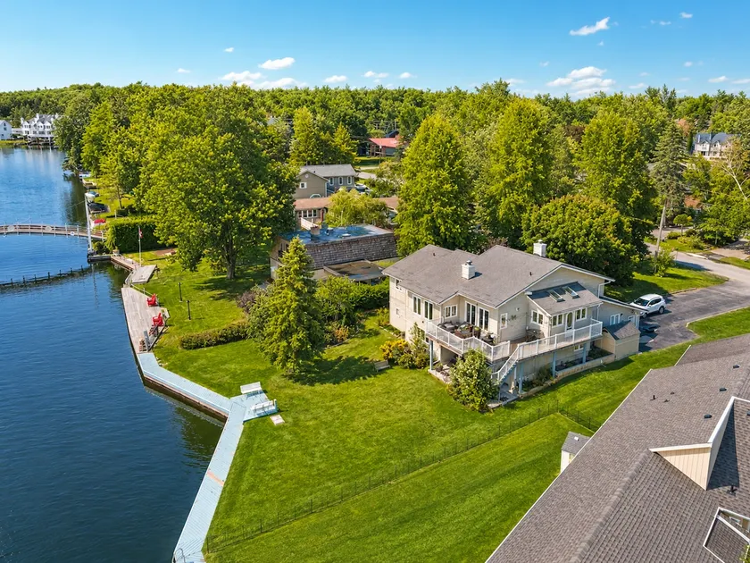 Canalside Summer Cottage with Waterview, Custom Bar, BBQ, and Fireplace - Image 1