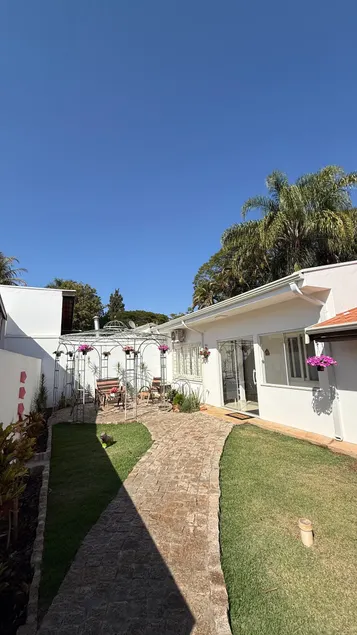 House among cafes and flowers - Image 1