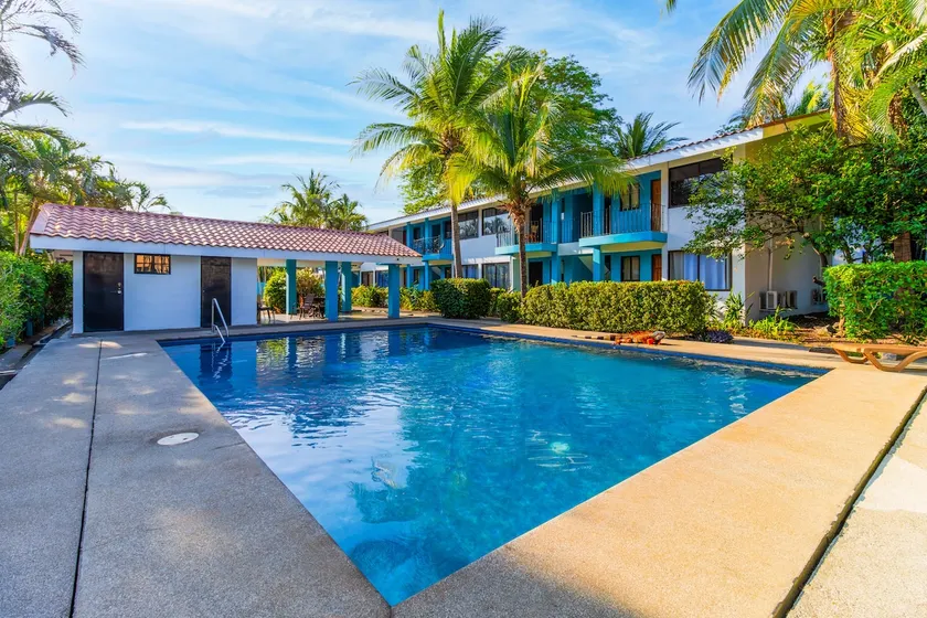Sun-Kissed 2BR Oasis — A Pool & 5-Min to the Beach - Image 1