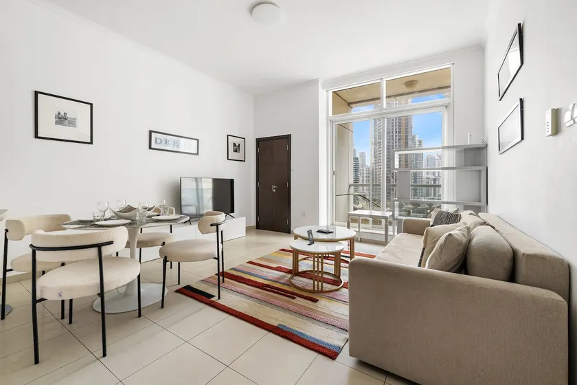 1BR Apartment with Balcony & Marina Views - Image 1