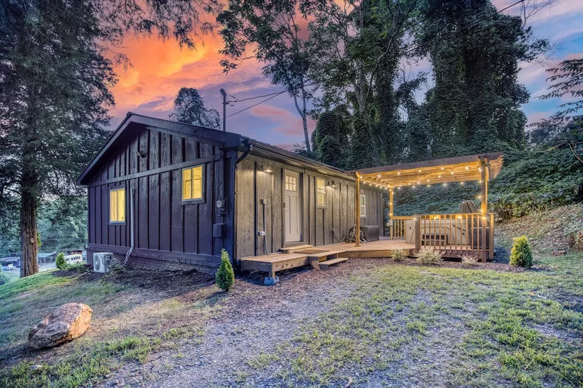 Hot Tub + River Views | Boutique Black Cottage - Image 1