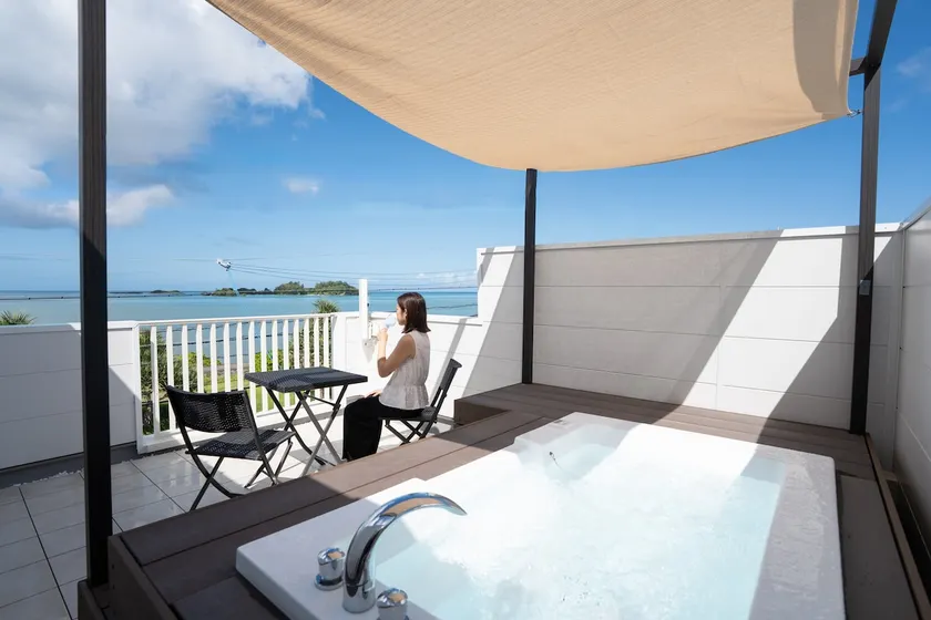 Sunset in the rooftop Jacuzzi | Okinawa, where you can live like you do at home | 4 people, 1LDK 70 ㎡ - Image 1