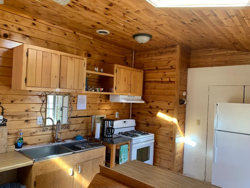 Sunshine Suite with fenced in dog yard and patio. - Image 1