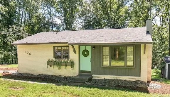 Charming brick cottage in a serene setting. - Image 1
