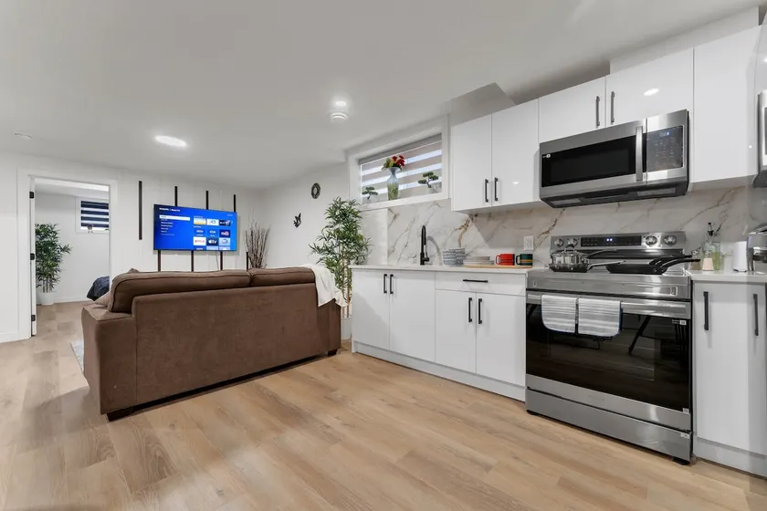 2-bedroom suite close to Amenities and Airport with on pad parking - Image 1