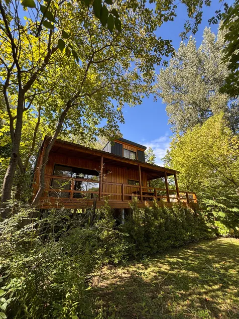Riverside cabin with private shore and dock - Image 1
