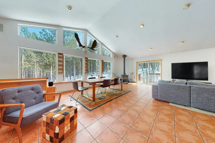 Dog-friendly home with large deck, hot tub, woodstove, W/D, & serene setting - Image 1