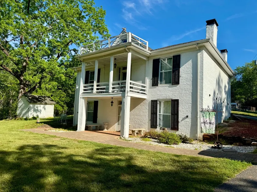 1885 Farmhouse on 11 Acres w/ Pool & Disc Golf - Image 1